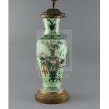 A Chinese 'Hundred Antiques' lime green ground vase, 19th century, converted to a lamp, painted with