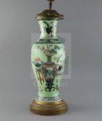 A Chinese 'Hundred Antiques' lime green ground vase, 19th century, converted to a lamp, painted with