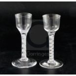 Two double series opaque twist stem cordial glasses, c.1760, each with a bucket shaped bowl and