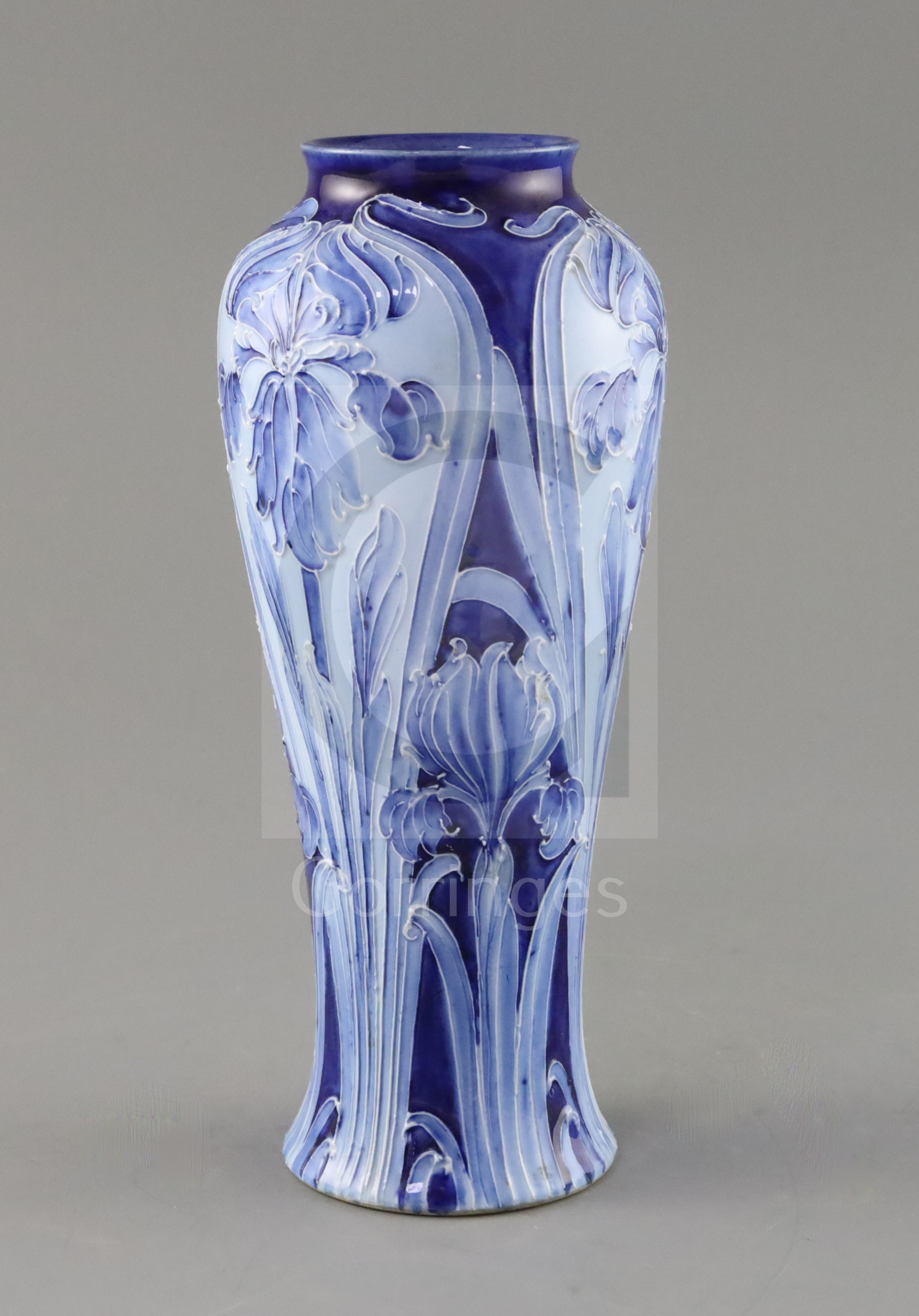 A Moorcroft Florian ware 'Iris' vase, c.1900, of tall baluster form, decorated in blue and white