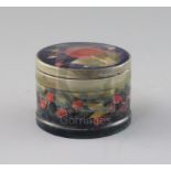 A Moorcroft 'pomegranate' pattern drum shaped box and cover, c.1918-26, with metal mounted rim,