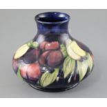 A Moorcroft 'wisteria' squat baluster vase, c.1920-5, impressed marks Moorcroft Made in England