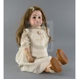 A French Dep doll, marked on head, with closed mouth, fixed eyes and fixed wrists, wearing vintage