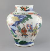 A Chinese wucai baluster vase, Transitional period c.1640, painted with the figure of an immortal