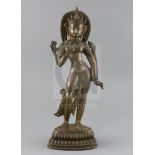 A Himalayan bronze figure of White Tara, 18th/19th century, standing on a double lotus base, H. 38.