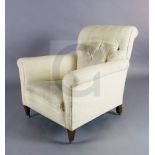 A Howard and Sons club armchair, with buttoned back upholstery and squared legs, on brass castors