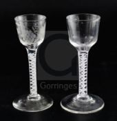 Two double series opaque twist stem cordial glasses, c.1760, each with a bucket-shaped bowl, one