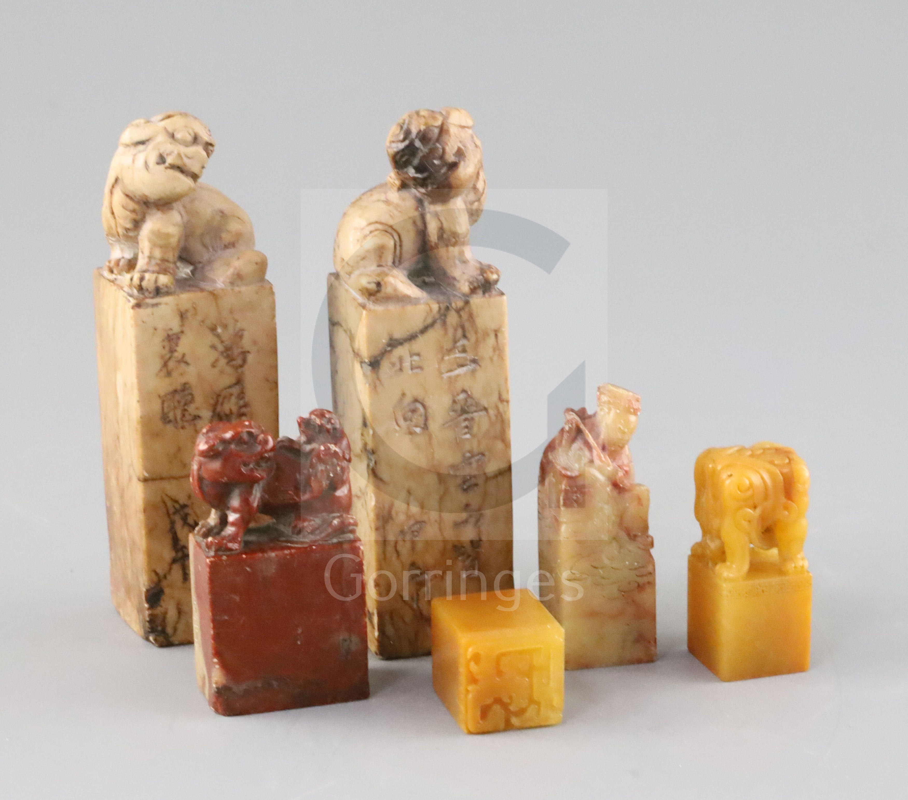 Six Chinese soapstone seals, including a pair surmounted by lion-dogs, two others with lion-dog