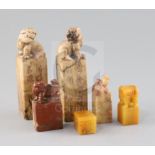 Six Chinese soapstone seals, including a pair surmounted by lion-dogs, two others with lion-dog