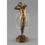 Leon-Louis Oury (1867-1940). A bronze figure of a stretching female nude, signed and inscribed