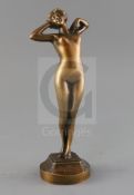 Leon-Louis Oury (1867-1940). A bronze figure of a stretching female nude, signed and inscribed
