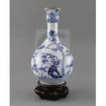 A Chinese blue and white guglet vase, 18th century, painted with rockwork, bamboo, pine and flowers,