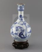 A Chinese blue and white guglet vase, 18th century, painted with rockwork, bamboo, pine and flowers,