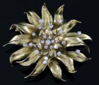 A gold and diamond 'chrysanthemum' brooch by Garrard, set with 22 brilliants (tests as 18ct), cased,