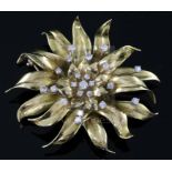 A gold and diamond 'chrysanthemum' brooch by Garrard, set with 22 brilliants (tests as 18ct), cased,