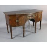 A George III mahogany bowfront sideboard with central drawer flanked by a cupboard and deep