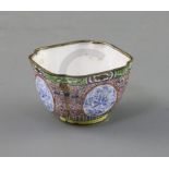 A Chinese enamel on copper cup, 18th century, of quatrelobed from, finely decorated with floral