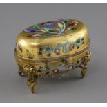 A 19th century Russian enamelled ormolu casket, of oval form, decorated with flowers, standing on