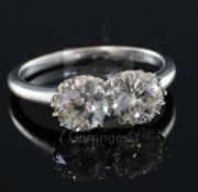 An 18ct white gold and two stone diamond ring, each stone weighing approximately 1.00ct, size P/Q.