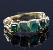 An early Victorian gold and foil backed? emerald five stone half hoop ring, with closed back