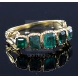 An early Victorian gold and foil backed? emerald five stone half hoop ring, with closed back
