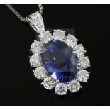 A platinum-set sapphire and diamond oval cluster pendant on 18ct white gold chain, pendant 28mm