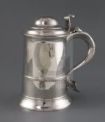 A George III silver tankard by Thomas Wallis I, with banded girdle, fluted thumbpiece and S-scroll