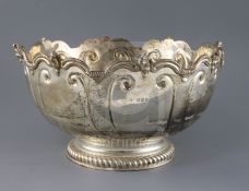 A late Victorian silver Monteith bowl, with scroll and mask border, and engraved inscription, maker,