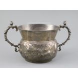 A A large 19th century 17th century style two handled silver porringer,