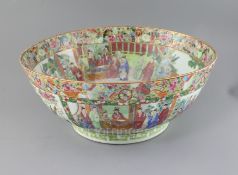 A large Chinese Canton-decorated famille rose punch bowl, c.1830, the interior and exterior