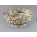 A large Chinese Canton-decorated famille rose punch bowl, c.1830, the interior and exterior