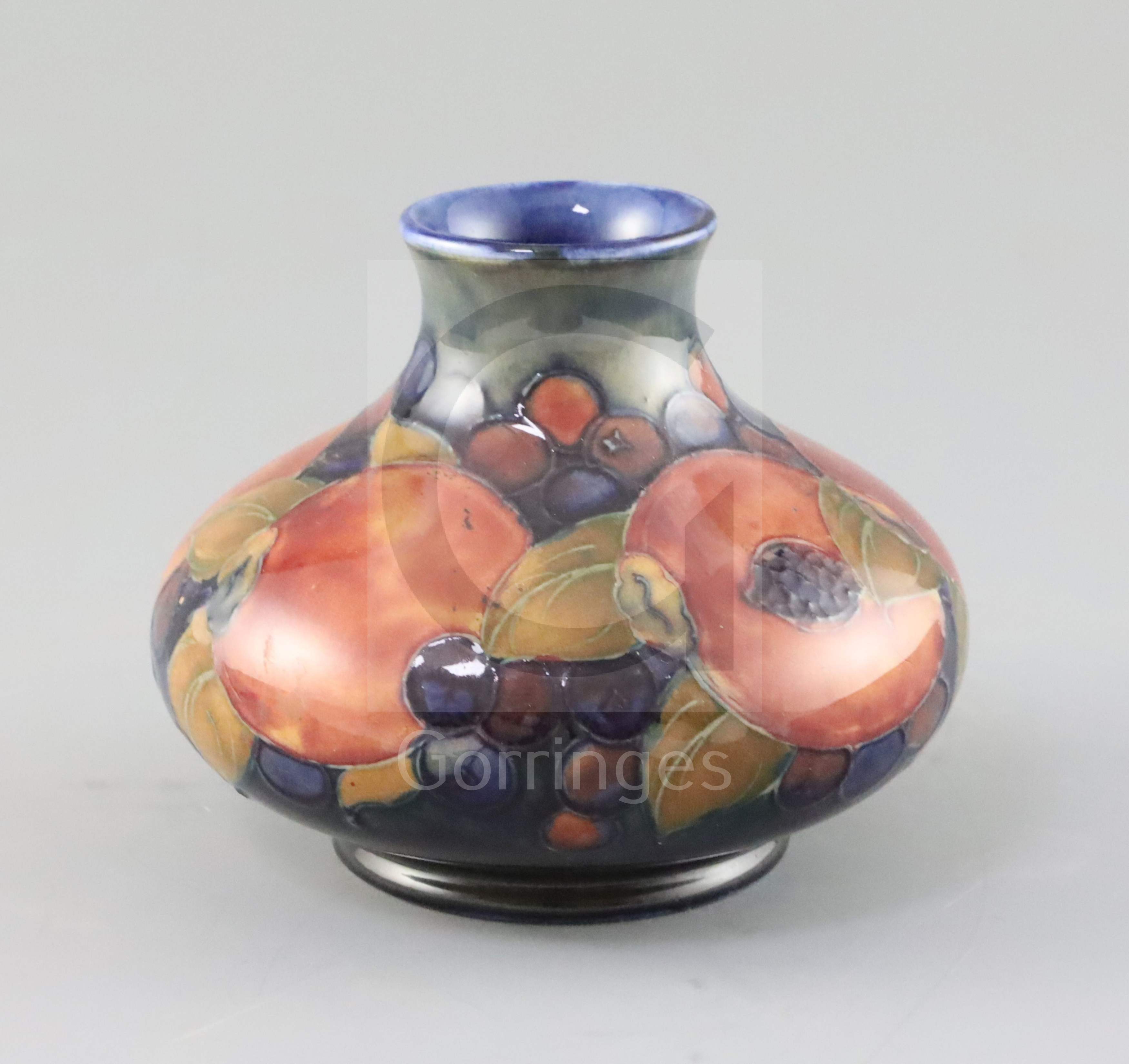 A Moorcroft 'pomegranate' squat baluster vase, c.1918-26, impressed mark Moorcroft Made in England