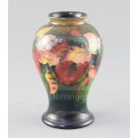 A Moorcroft 'orchid' flambe small baluster vase, 1930/40's, impressed W. Moorcroft Potter to HM