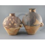 Two Chinese terracotta two handled jars, Neolithic period or later, the largest decorated in black