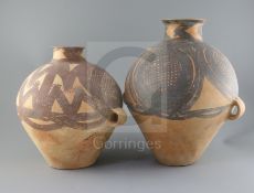 Two Chinese terracotta two handled jars, Neolithic period or later, the largest decorated in black