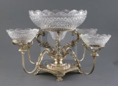 An early 19th century Old Sheffield plate centrepiece, with large cut glass bowl on four scroll