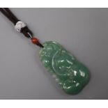 A jade pendant (strung)