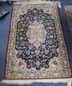 An Isphahan cream and blue medallion rug 133 x 78cm