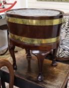 An 18th century mahogany oval brass bound wine cooler W.62cm