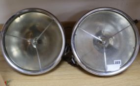 A pair of Lucas p100 Headlamps