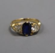 A yellow metal, sapphire and diamond three stone ring (two small diamonds missing and re-sized),