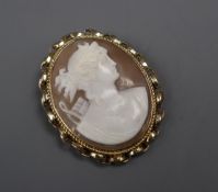 A yellow metal mounted oval cameo pendant brooch, the cameo carved with Diana to sinister, 42mm.
