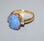 An opal and diamond three-stone dress ring, 18ct yellow gold setting and shank, size O/P.