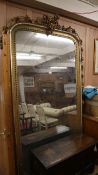 A large Victorian giltwood and gesso overmantel mirror with cherub pediment H.240cm