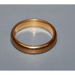 A 22ct gold wedding band, size M.