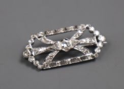 A mid 20th century white metal and diamond cluster set openwork hexagonal brooch, 33mm.