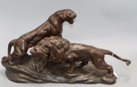 After Cartier. A bronzed spelter group, Lion and Lioness height 29cm