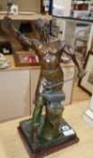 After Lemoyne. A bronzed spelter figure of a Blacksmith "Le Travail" height 57cm