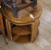 A nest of Art Deco style walnut occasional tables Diameter 60cm