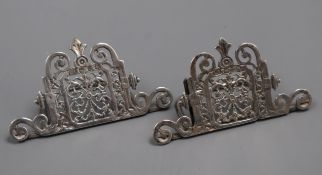 A pair of Victorian silver pierced menu holders by Lawrence Emmanuel, Birmingham, 1894, width 86mm.